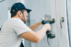 Professional shower door installation on tiled bathroom wall demonstrating how long does it take to install a shower door. 